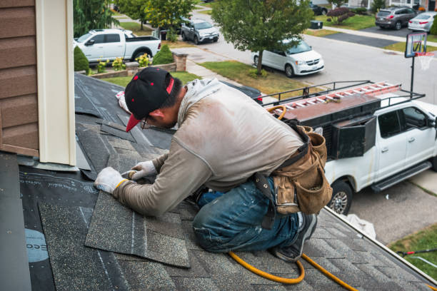 Professional Roofing technician working in West Bay Shore, NY